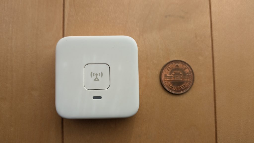 あんしんウォッチャーと10円玉の写真（正面）